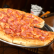 Illustration for article titled Pizza Hut tries charging 99 cents for pepper flakes, cheese shakersem/em